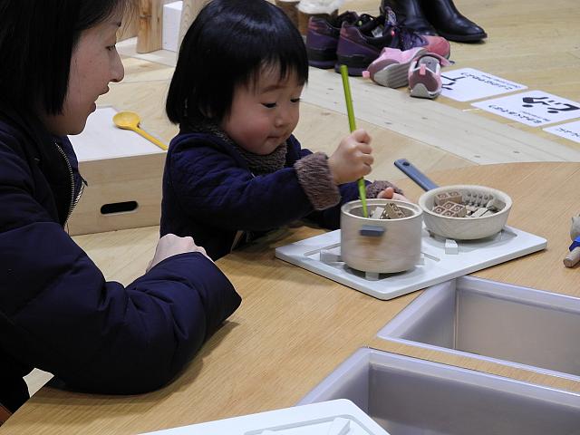 Training starts early. Chopsticks and Lego the ideal combination